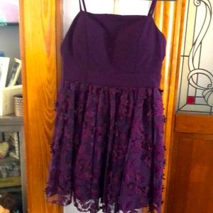 Beautiful plum dress, worn once. Adjustable strap. No wear or tears.